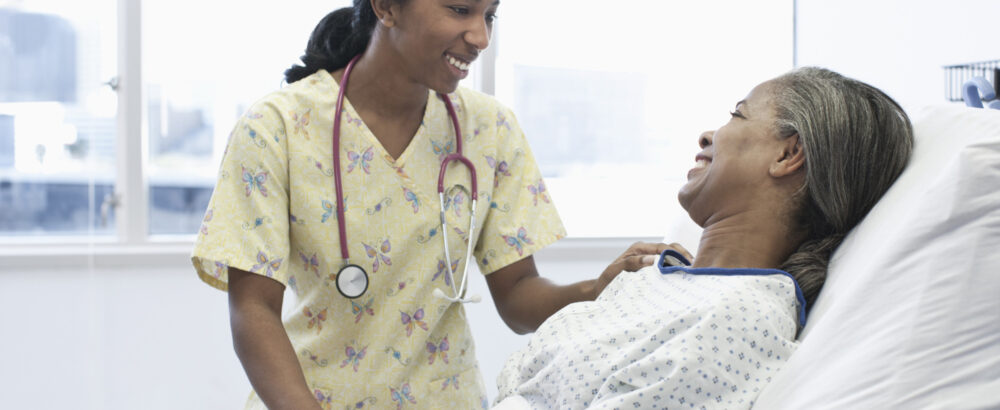 o-AFRICAN-AMERICAN-PATIENT-facebook Nurse and patient talking in hospital